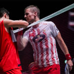 Hans-Kristian Solberg Vittinghus (R) congratulates Kento Momota after the Japan Open first round match. (photo: Shi Tang/Getty Images)