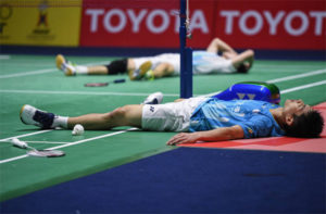 Chou Tien Chen (front) and Angus Ng Ka Long lying on the court after an epic Thailand Open final battle. (photo: Chalinee Thirasupa/AFP/Getty Images)