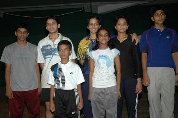 First row: PV Sindhu (center-right) with future Olympic bronze medalist Saina Nehwal (back row, center), Sikki Reddy (back row, 2nd right), Parupalli Kashyap (back row, 2nd left) and other winners of the all-India junior ranking badminton tournament in Kochi in June 2005. (photo: PTI)