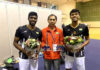 Flandy Limpele poses with India's men's doubles players Satwiksairaj Rankireddy (left) and Chirag Shetty. (photo: AFP)