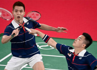 Aaron Chia/Soh Wooi Yik record first win in their Olympics debut on Saturday. (photo: Alexander Nemenov/AFP)