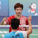 Shi Yuqi greets Lu Guangzu after winning the men’s singles gold medal at China’s 14th National Games. (photo: Weibo)
