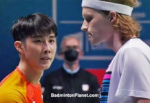 Loh Kean Yew (L) greets Anders Antonsen after the 2021 BWF World Championships semi-final match.