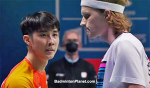 Loh Kean Yew (L) greets Anders Antonsen after the 2021 BWF World Championships semi-final match.