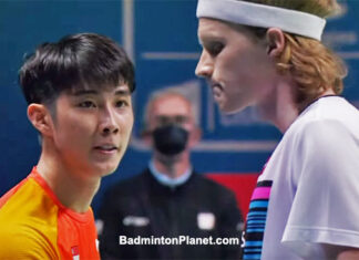 Loh Kean Yew (L) greets Anders Antonsen after the 2021 BWF World Championships semi-final match.