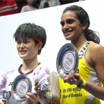 PV Sindhu and Wang Zhiyi pose for pictures at the awards ceremony.