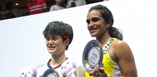 PV Sindhu and Wang Zhiyi pose for pictures at the awards ceremony.