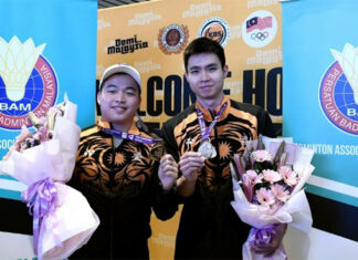 Aaron Chia/Soh Wooi Yik receive hero's welcome at Kuala Lumpur International Airport on Thursday. (photo: Bernama)