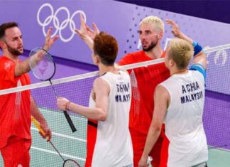 A strong comeback win for Aaron Chia/Soh Wooi Yik against Ben Lane/Sean Vendy in Olympic opening match. (Photo: AFP)