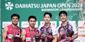 Nur Izzuddin/Goh Sze Fei pose with Seo Seung Jae/Kang Min Hyuk (L-R) at the 2024 Japan Open awards ceremony. (Photo: Shi Tang/Getty Images)