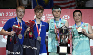 Aaron Chia and Soh Wooi Yik celebrate their thrilling victory at the 2025 Thailand Open — their second title of the season with William Kryger Boe/Christian Faust Kjaer during the awards ceremony. (Photo: BWF)