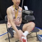 Chou Tien Chen sits with his gold medal after winning the 2025 Arctic Open, his sock stained with blood from a blistered foot. (Photo: Social Media)