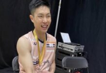 Chou Tien Chen sits with his gold medal after winning the 2025 Arctic Open, his sock stained with blood from a blistered foot. (Photo: Social Media)