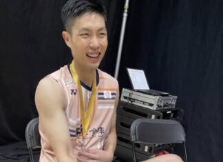 Chou Tien Chen sits with his gold medal after winning the 2025 Arctic Open, his sock stained with blood from a blistered foot. (Photo: Social Media)