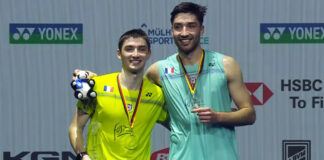 Christo Popov (L) poses for pictures with Toma Junior Popov during the awards ceremony at the 2026 German Open. (Photo: BWF)