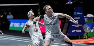 Aaron Chia and Soh Wooi Yik celebrate reaching the 2026 All England badminton final. (Photo: AFP)