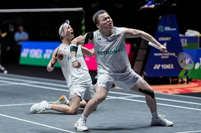 Aaron Chia and Soh Wooi Yik celebrate reaching the 2026 All England badminton final. (Photo: AFP)