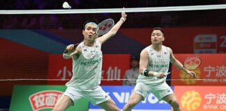 Malaysia’s Aaron Chia and Soh Wooi Yik compete in a tense quarterfinal match at the Badminton Asia Championships in Ningbo. (Photo: AFP)