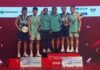Aaron Chia and Soh Wooi Yik pose alongside Man Wei Chong and Tee Kai Wun with their coaches after an all-Malaysian final at the 2025 Malaysia Masters awards ceremony. (Photo: BWF)
