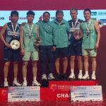 Aaron Chia and Soh Wooi Yik pose alongside Man Wei Chong and Tee Kai Wun with their coaches after an all-Malaysian final at the 2025 Malaysia Masters awards ceremony. (Photo: BWF)