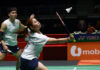 Malaysian mixed doubles pair Jimmy Wong and Cheng Su Yin celebrating their massive badminton upset against world number ones at the Singapore Open. (Photo: Bernama)