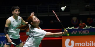 Malaysian mixed doubles pair Jimmy Wong and Cheng Su Yin celebrating their massive badminton upset against world number ones at the Singapore Open. (Photo: Bernama)
