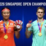 An Se Young and Alex Lanier celebrate their Singapore Open badminton titles after winning the women’s singles and men’s singles finals. (Photo: AFP)
