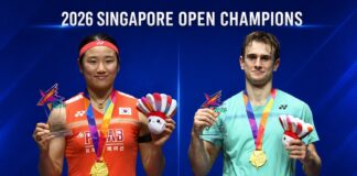 An Se Young and Alex Lanier celebrate their Singapore Open badminton titles after winning the women’s singles and men’s singles finals. (Photo: AFP)