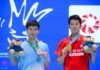 Hu Zhe An and Kantaphon Wangcharoen pose together during the awards ceremony at the 2026 Macau Open badminton tournament. (Photo: Xinhua)