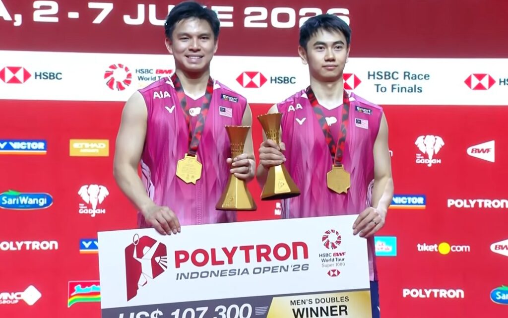 Goh Sze Fei and Nur Izzuddin Rumsani pose with their trophy after winning the 2026 Indonesia Open badminton men’s doubles title in Jakarta. (Photo: BWF)