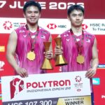 Goh Sze Fei and Nur Izzuddin Rumsani pose with their trophy after winning the 2026 Indonesia Open badminton men’s doubles title in Jakarta. (Photo: BWF)