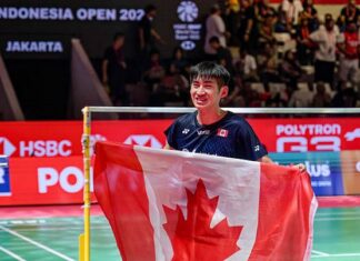 Victor Lai Makes History as An Se Young Defends Indonesia Open Title Victor Lai celebrates with a Canadian flag after defeating Jonatan Christie to win the Indonesia Open badminton men’s singles title in Jakarta. (Photo: AFP)
