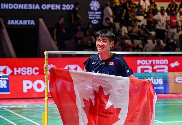 Victor Lai celebrates with a Canadian flag after defeating Jonatan Christie to win the Indonesia Open badminton men’s singles title in Jakarta. (Photo: AFP) Victor Lai celebrates with a Canadian flag after defeating Jonatan Christie to win the Indonesia Open badminton men’s singles title in Jakarta. (Photo: AFP)