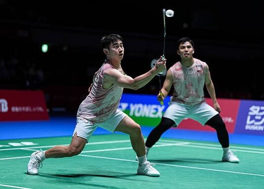 Goh Sze Fei and Nur Izzuddin battled through a difficult three-game match to reach the China Open second round. (Photo: AFP)