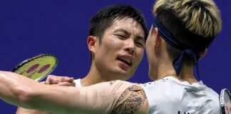 Chou Tien Chen shakes hands with Lin Chun-Yi after defeating his compatriot in the 2026 China Open badminton semifinals. (Photo: AFP)