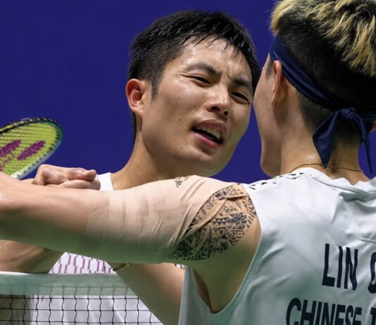 Chou Tien Chen shakes hands with Lin Chun-Yi after defeating his compatriot in the 2026 China Open badminton semifinals. (Photo: AFP)