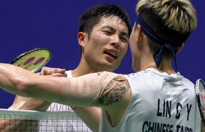 Chou Tien Chen shakes hands with Lin Chun-Yi after defeating his compatriot in the 2026 China Open badminton semifinals. (Photo: AFP)