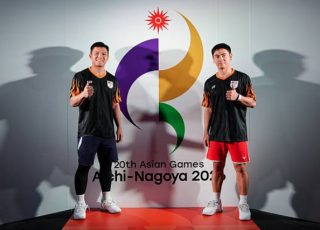 Goh Sze Fei and Nur Izzuddin Rumsani flex their strength against their Mongolian opponents during Malaysia’s men’s team tie at the 2026 Aichi-Nagoya Asian Games. (Photo: Asian Games)